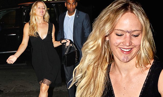 Jennifer Lawrence embraces the whimsical spirit with a playful transformation, donning an American stubble of a moustache, goatee, and unibrow!